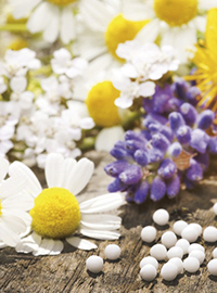 Vortrag: Homöopathie für Frauen, Vild mit Blumen und Tabletten